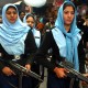 e right is wearing delicate henna on her hands, and both submissive Muslim women are wearing a girlish lace-trim on their encumbering headscarve